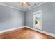 Bedroom with hardwood floors, shiplap walls, and a bright window at 233 Sellars Rd, Kings Mountain, NC 28086