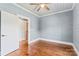 Bedroom with hardwood floors, shiplap walls, ceiling fan, and white trim at 233 Sellars Rd, Kings Mountain, NC 28086