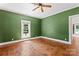 Bedroom with hardwood floors, green walls and natural lighting for a peaceful retreat at 233 Sellars Rd, Kings Mountain, NC 28086