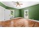 Spacious bedroom with hardwood floors, two large windows, and a walk-in closet at 233 Sellars Rd, Kings Mountain, NC 28086