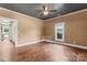 Bright bedroom featuring hardwood floors, natural lighting, and neutral colored walls at 233 Sellars Rd, Kings Mountain, NC 28086