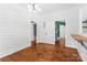 Open dining room with hardwood floors, views of two other rooms, and a modern chandelier at 233 Sellars Rd, Kings Mountain, NC 28086