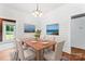 Dining room with shiplap walls, hardwood floors, modern table and six chairs at 233 Sellars Rd, Kings Mountain, NC 28086