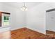 Bright dining room with hardwood floors, shiplap walls, and elegant chandelier at 233 Sellars Rd, Kings Mountain, NC 28086