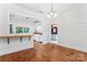 Open dining room with hardwood floors and a view into the kitchen at 233 Sellars Rd, Kings Mountain, NC 28086