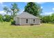 Well-kept single-story home with a lush green lawn, showcasing its simple architectural design and curb appeal at 233 Sellars Rd, Kings Mountain, NC 28086