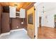 Cozy laundry room featuring storage cabinets and a decorative laundry room door at 233 Sellars Rd, Kings Mountain, NC 28086