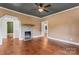 Spacious living room with hardwood floors, stone fireplace, and neutral color palette at 233 Sellars Rd, Kings Mountain, NC 28086