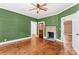 Comfortable living room with original hardwood floors, and a brick fireplace at 233 Sellars Rd, Kings Mountain, NC 28086