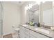 Modern bathroom featuring double sinks, a spacious vanity, and walk-in shower with glass doors at 3007 Citizens Ln, Charlotte, NC 28205