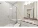 Modern bathroom showcases a tiled shower with a built-in bench and vanity with stone countertop at 3007 Citizens Ln, Charlotte, NC 28205