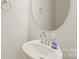 Chic bathroom includes a modern sink, round mirror, and sleek fixtures at 3007 Citizens Ln, Charlotte, NC 28205