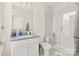 Bright bathroom featuring a walk-in shower with bench and white marble tile at 3007 Citizens Ln, Charlotte, NC 28205