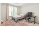 Bright bedroom with a workspace, a large window, and plush carpeting at 3007 Citizens Ln, Charlotte, NC 28205