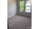 Bright bedroom showcasing large windows offering views and abundant natural light at 3007 Citizens Ln, Charlotte, NC 28205