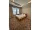 Comfortable bedroom featuring a neutral color scheme, large windows, and plush carpeting at 3007 Citizens Ln, Charlotte, NC 28205