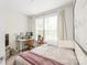 Well-lit bedroom provides comfort with two large windows, a desk, and cozy furnishings at 3007 Citizens Ln, Charlotte, NC 28205