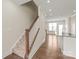 Bright entryway featuring hardwood floors and staircase leading to the upper level at 3007 Citizens Ln, Charlotte, NC 28205