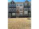 Charming townhome with a well-maintained lawn and attractive architectural details at 3007 Citizens Ln, Charlotte, NC 28205