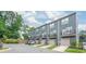 Charming gray townhomes featuring private garages, balconies, and well-maintained landscaping at 3007 Citizens Ln, Charlotte, NC 28205