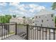 Apartment complex with street parking viewed from a balcony with black railings at 3007 Citizens Ln, Charlotte, NC 28205