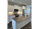 Modern kitchen featuring stainless steel appliances, gray countertops, and white cabinetry at 3007 Citizens Ln, Charlotte, NC 28205