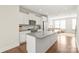 Stylish kitchen with white cabinets, stainless steel appliances, granite countertops, and open floor plan at 3007 Citizens Ln, Charlotte, NC 28205
