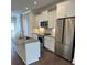 Modern kitchen featuring stainless steel appliances, gray countertops, and white cabinetry at 3007 Citizens Ln, Charlotte, NC 28205