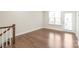 Hardwood floors fill this bonus room area, connecting to a light filled door to the outside at 3007 Citizens Ln, Charlotte, NC 28205