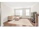 Cozy living room with plush sectional sofa, hardwood floors, and natural light from bright windows at 3007 Citizens Ln, Charlotte, NC 28205