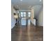 Inviting open floorplan with a spacious kitchen island and hardwood floors throughout at 3007 Citizens Ln, Charlotte, NC 28205
