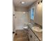 This bathroom features a shower, vanity, and sleek fixtures for a relaxing experience at 32874 Old Salisbury Rd, Albemarle, NC 28001