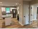 The kitchen features ample counter space, island, stainless steel appliances, and stylish cabinets at 32874 Old Salisbury Rd, Albemarle, NC 28001