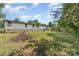 The spacious backyard features mature trees, a storage shed, and grassy areas, offering a peaceful outdoor setting at 3585 Woodstream Dr, Maiden, NC 28650