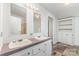Bright bathroom featuring dual vanities, tiled floors, and an enclosed shower area, offering comfort and functionality at 3585 Woodstream Dr, Maiden, NC 28650