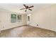 Spacious bedroom with wood flooring, ceiling fan and a view to the backyard at 3585 Woodstream Dr, Maiden, NC 28650