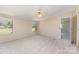 Bedroom featuring neutral carpet, ceiling fan, and a view of the backyard at 3585 Woodstream Dr, Maiden, NC 28650