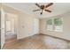 Spacious bedroom with wood flooring, ceiling fan and a view to the backyard at 3585 Woodstream Dr, Maiden, NC 28650
