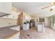 Open kitchen featuring tiled floors, white cabinetry, stainless steel appliances, and a breakfast bar at 3585 Woodstream Dr, Maiden, NC 28650
