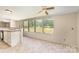 Bright kitchen area with a breakfast bar that offers outdoor views from the many windows at 3585 Woodstream Dr, Maiden, NC 28650