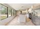 Bright kitchen features neutral tones, an island, and stainless steel refrigerator with a 'Kitchen Rules' decal at 3585 Woodstream Dr, Maiden, NC 28650