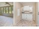 Bright kitchen features neutral tones and white cabinets with decorative glass at 3585 Woodstream Dr, Maiden, NC 28650