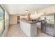 Open concept kitchen featuring a breakfast bar, tile flooring, stainless steel appliances, and a ceiling fan at 3585 Woodstream Dr, Maiden, NC 28650