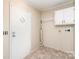 Mud/laundry room features tile flooring, storage cabinets, and exterior access at 3585 Woodstream Dr, Maiden, NC 28650