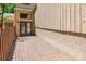 A spacious, wooden back porch offers a private retreat for outdoor relaxation and entertaining at 4025 Ivystone Ct, Charlotte, NC 28277