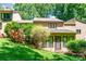 Private backyard with mature landscaping, a green lawn and convenient access to the home at 4025 Ivystone Ct, Charlotte, NC 28277