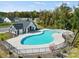 Aerial shot of an outdoor community pool area with bath house surrounded by a black metal fence at 4122 Vista Pine Dr, Charlotte, NC 28215