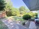 Spacious backyard with brick patio and stone-lined garden beds at 436 8Th Avenue Nw Dr, Hickory, NC 28601