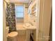 Bright bathroom features classic black and white tile, shower and pedestal sink at 436 8Th Avenue Nw Dr, Hickory, NC 28601