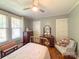 Comfortable bedroom with hardwood floors, vintage furniture, and bright windows at 436 8Th Avenue Nw Dr, Hickory, NC 28601